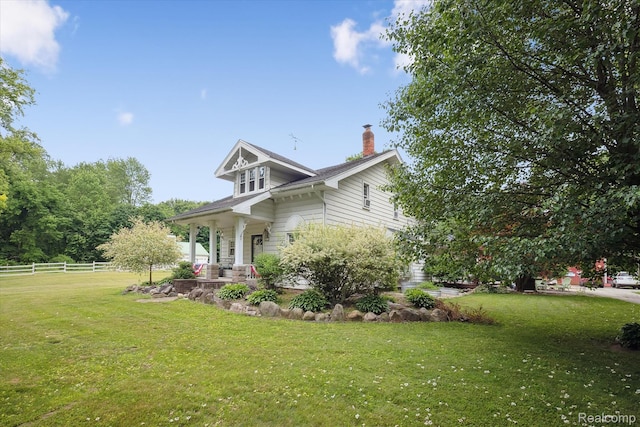 8450 Rosbolt Rd, Willis, MI 48191 - view of property exterior featuring a chimney and a porch