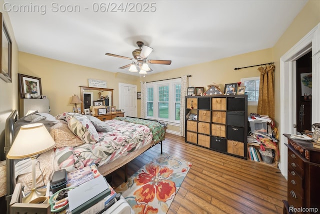 8450 Rosbolt Rd, Willis, MI 48191 - bedroom with wood-type flooring and a ceiling fan
