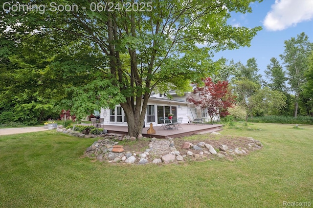 8450 Rosbolt Rd, Willis, MI 48191 - rear view of house with a deck and a yard