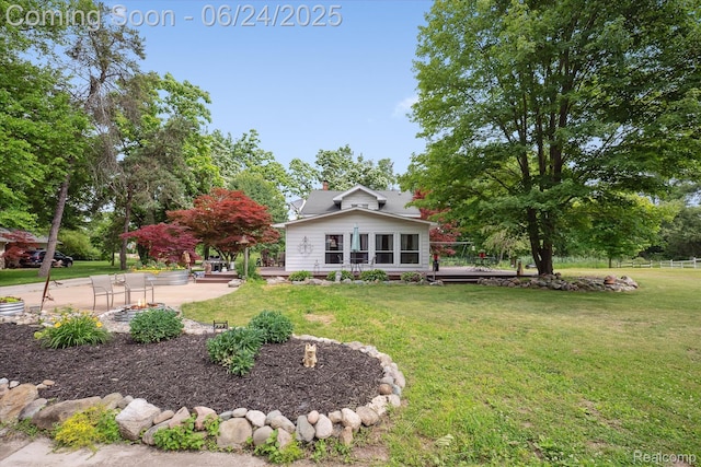 8450 Rosbolt Rd, Willis, MI 48191 - rear view of house featuring a deck, a yard, and a patio area