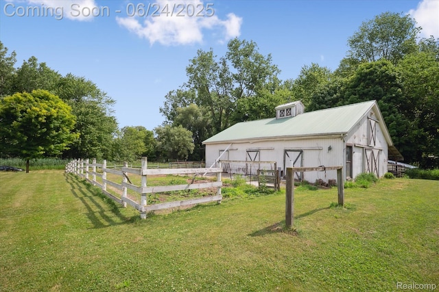 8450 Rosbolt Rd, Willis, MI 48191 - view of yard featuring a detached garage and an outbuilding