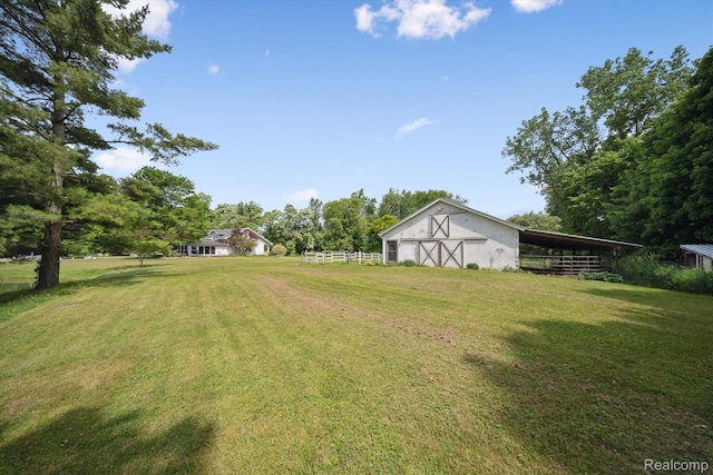 8450 Rosbolt Rd, Willis, MI 48191 - view of yard featuring a detached garage, an outdoor structure, and a pole building