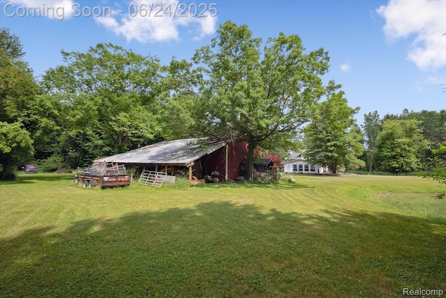 8450 Rosbolt Rd, Willis, MI 48191 - view of grassy yard with an outdoor structure and an outbuilding
