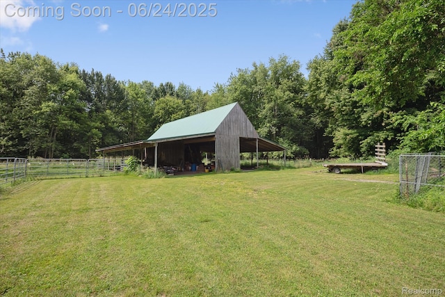 8450 Rosbolt Rd, Willis, MI 48191 - view of yard with an outbuilding and a forest view