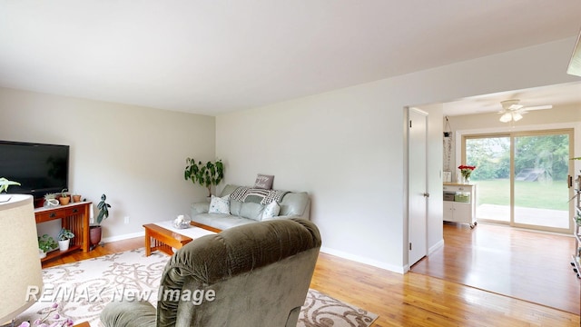 5071 Heidi Ln, Saginaw, MI 48604 - living area with light wood finished floors and a ceiling fan