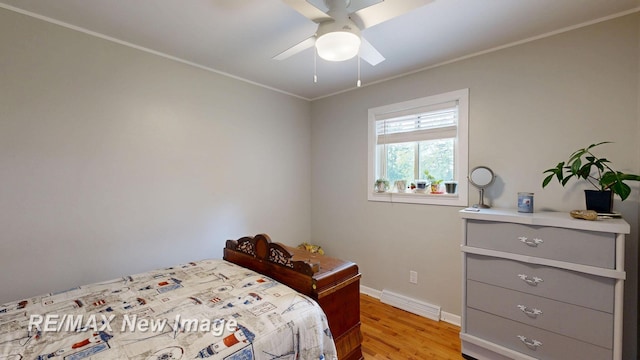 5071 Heidi Ln, Saginaw, MI 48604 - bedroom with light wood-type flooring, ornamental molding, and ceiling fan