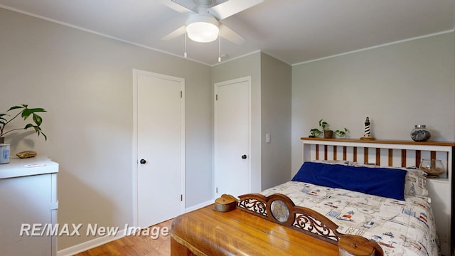 5071 Heidi Ln, Saginaw, MI 48604 - bedroom with wood finished floors, ornamental molding, and ceiling fan