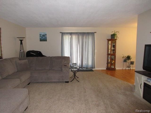 3521 Brandt Ln, Metamora, MI 48455 - living area featuring carpet floors and baseboards