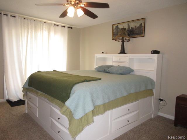 3521 Brandt Ln, Metamora, MI 48455 - bedroom with carpet floors and ceiling fan