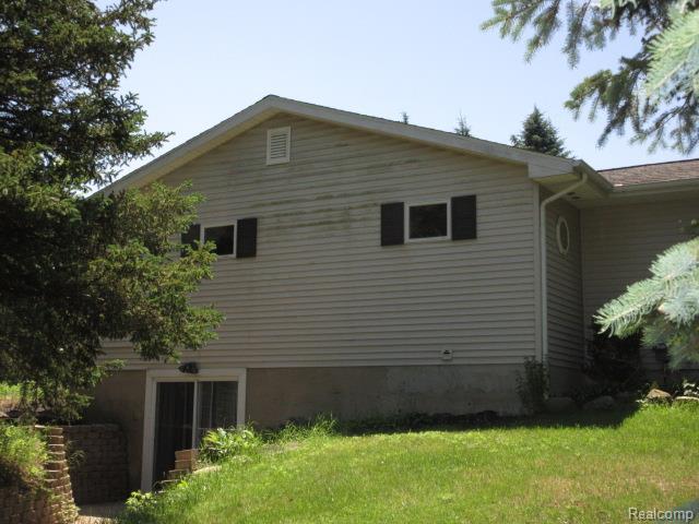 3521 Brandt Ln, Metamora, MI 48455 - view of property exterior with a yard