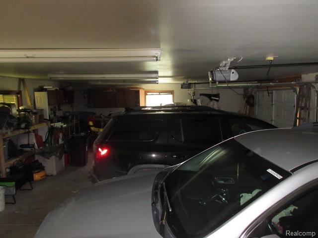 3521 Brandt Ln, Metamora, MI 48455 - garage with a garage door opener
