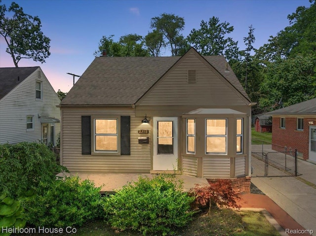 2718 Hubbard St, Dearborn, MI 48124 - view of front of house with a gate and a shingled roof