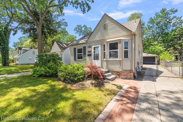 2718 Hubbard St, Dearborn, MI 48124 - bungalow-style house with an outdoor structure, brick siding, and a garage
