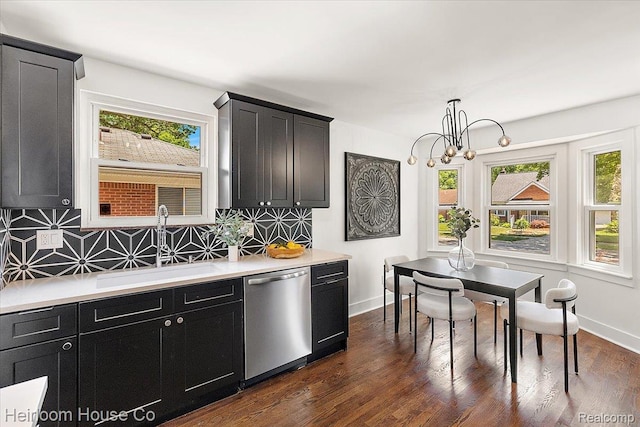 2718 Hubbard St, Dearborn, MI 48124 - kitchen with stainless steel dishwasher, dark cabinetry, and plenty of natural light