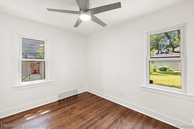 2718 Hubbard St, Dearborn, MI 48124 - empty room with plenty of natural light and dark wood-style floors