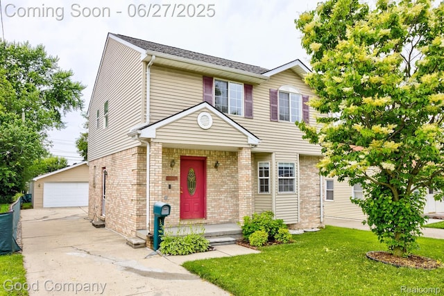30785 Alger Blvd, Madison Heights, MI 48071 - view of front of home with an outdoor structure, a front lawn, brick siding, and a garage