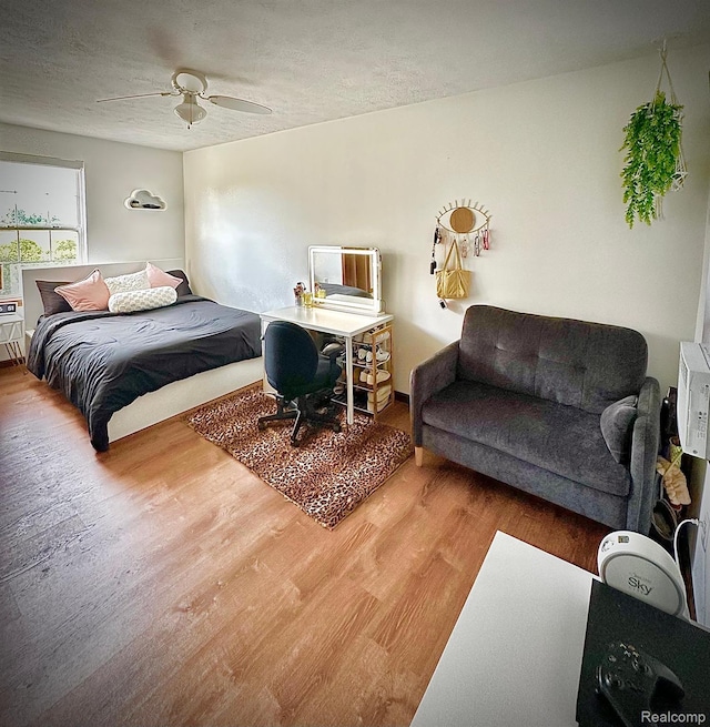 4502 E Wilkinson Rd, Owosso, MI 48867 - bedroom with wood finished floors and a ceiling fan
