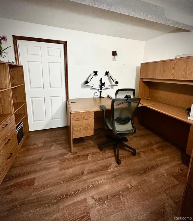 4502 E Wilkinson Rd, Owosso, MI 48867 - office space with dark wood-style flooring