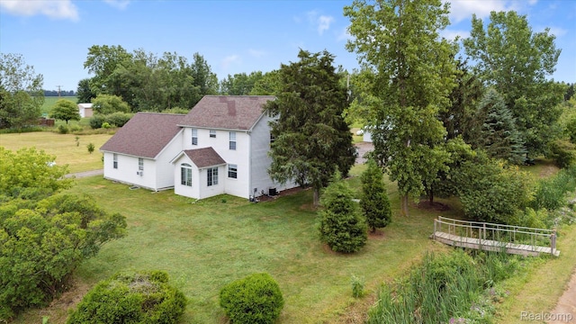 4502 E Wilkinson Rd, Owosso, MI 48867 - view of subject property with a tree filled landscape