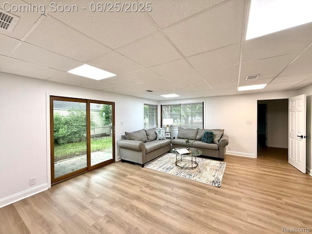 2526 Genes Dr, West Bloomfield, MI 48326 - living room with a paneled ceiling, light wood finished floors, and plenty of natural light