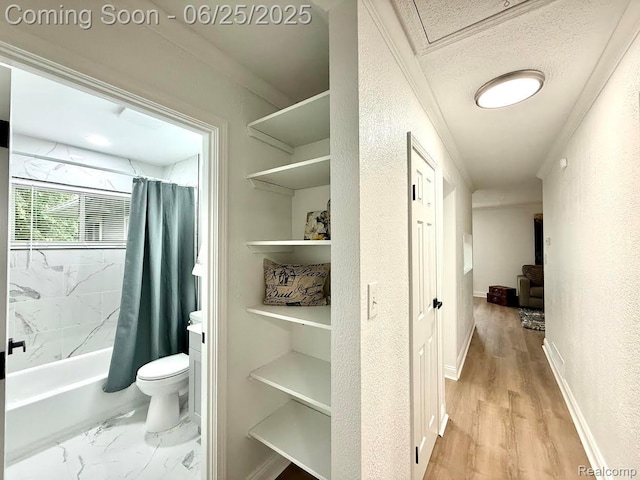 2526 Genes Dr, West Bloomfield, MI 48326 - bathroom featuring shower / bath combination with curtain, crown molding, wood finished floors, and a textured wall