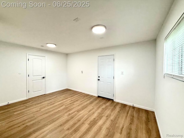 2526 Genes Dr, West Bloomfield, MI 48326 - empty room featuring wood finished floors and baseboards