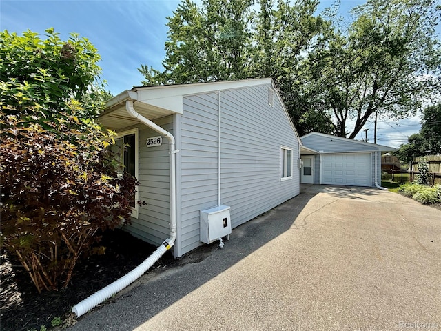 2526 Genes Dr, West Bloomfield, MI 48326 - view of home's exterior featuring driveway and an outbuilding