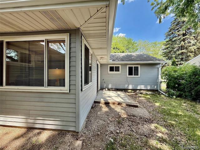 2526 Genes Dr, West Bloomfield, MI 48326 - view of home's exterior featuring a patio and a shingled roof