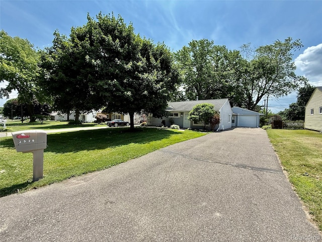 2526 Genes Dr, West Bloomfield, MI 48326 - view of front facade featuring a detached garage and a front yard