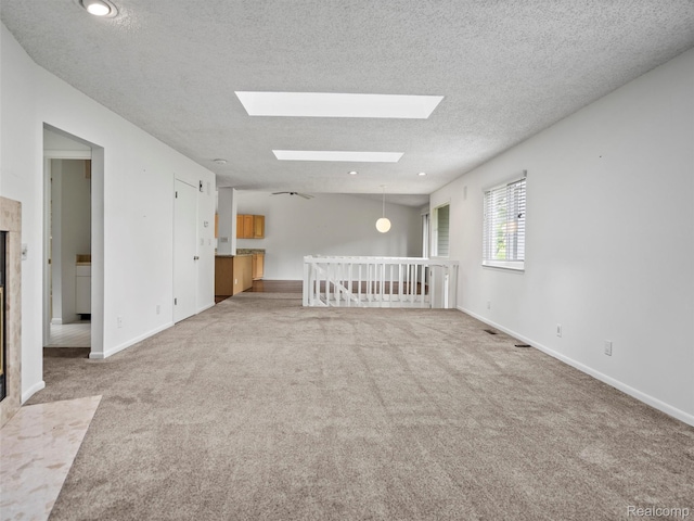 5620 Eastman Blvd, West Bloomfield, MI 48323 - spare room featuring carpet, a skylight, a textured ceiling, and recessed lighting