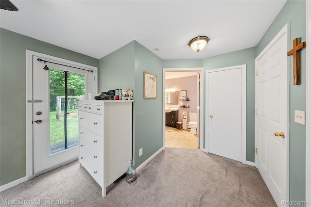 888 Mallock Rd, White Lake, MI 48386 - bedroom with access to exterior, light colored carpet, and ensuite bath