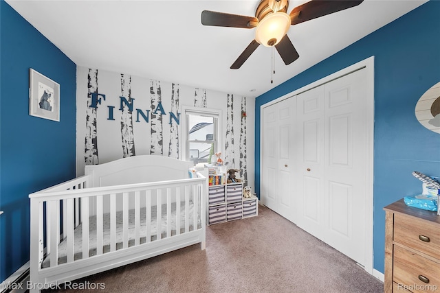 888 Mallock Rd, White Lake, MI 48386 - carpeted bedroom featuring a closet, a crib, and a ceiling fan