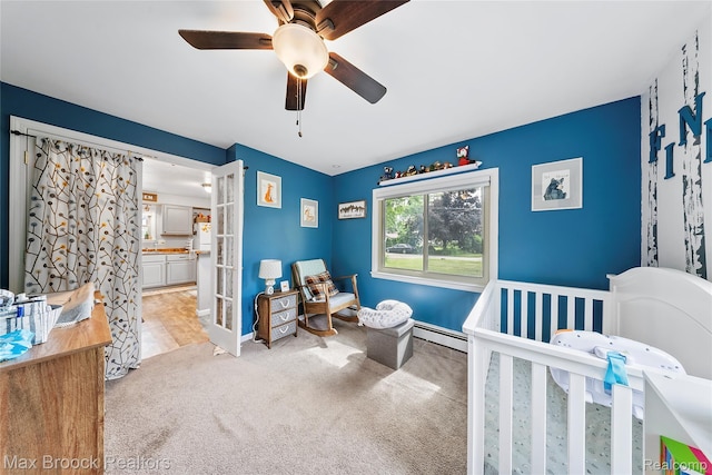 888 Mallock Rd, White Lake, MI 48386 - bedroom featuring light colored carpet, baseboard heating, a ceiling fan, and ensuite bathroom