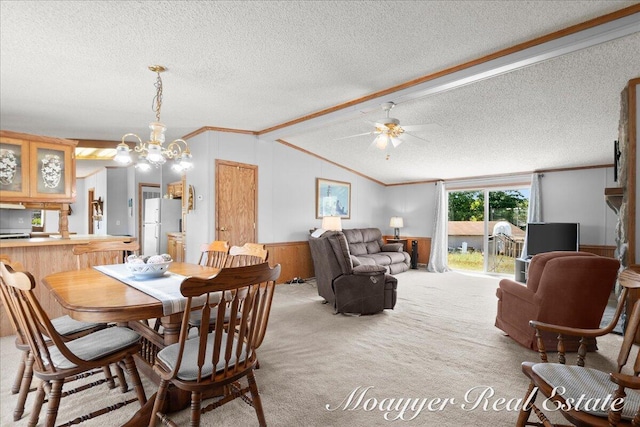 3516 140th Ave, Hamilton, MI 49419 - carpeted dining area with a textured ceiling, ornamental molding, vaulted ceiling, ceiling fan, and a wainscoted wall