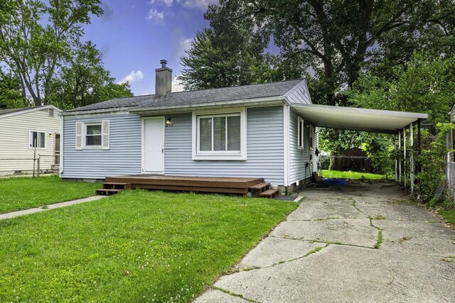 241 Dakota Ave, Ypsilanti, MI 48198 - view of front facade with a chimney, concrete driveway, and an attached carport