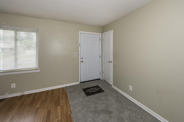 241 Dakota Ave, Ypsilanti, MI 48198 - foyer entrance featuring dark wood-type flooring and baseboards