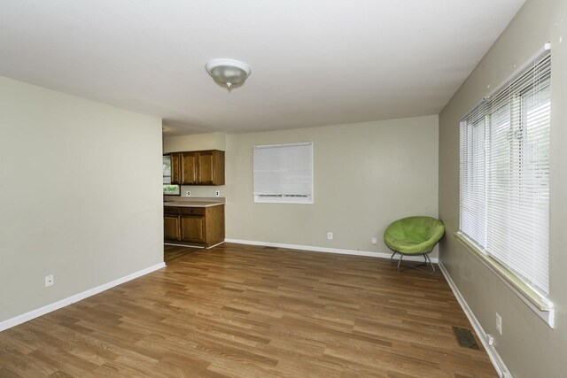 241 Dakota Ave, Ypsilanti, MI 48198 - unfurnished living room featuring light wood-style floors and baseboards