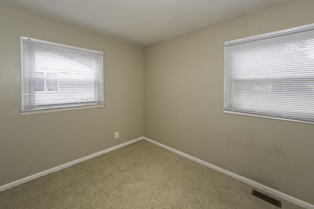 241 Dakota Ave, Ypsilanti, MI 48198 - carpeted empty room featuring baseboards