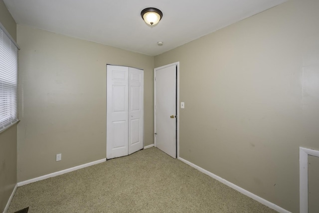 241 Dakota Ave, Ypsilanti, MI 48198 - unfurnished bedroom featuring light colored carpet and a closet