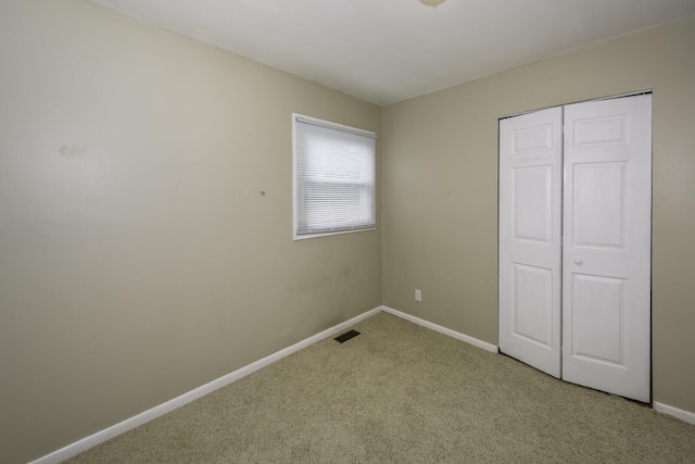 241 Dakota Ave, Ypsilanti, MI 48198 - unfurnished bedroom featuring light carpet and a closet