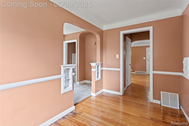 16746 Bramell St, Detroit, MI 48219 - unfurnished room with arched walkways and light wood-style flooring
