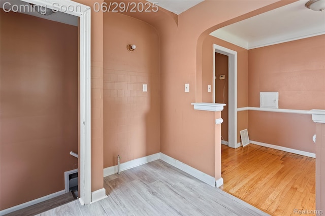 16746 Bramell St, Detroit, MI 48219 - empty room with wood finished floors and arched walkways