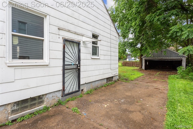 16746 Bramell St, Detroit, MI 48219 - view of property exterior featuring a garage and an outbuilding