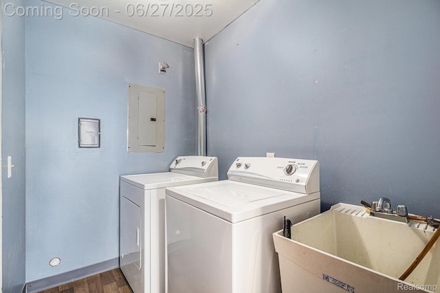 35692 Stillmeadow Ln, Shelby Twp, MI 48035 - laundry area featuring electric panel, washing machine and clothes dryer, and dark wood-type flooring