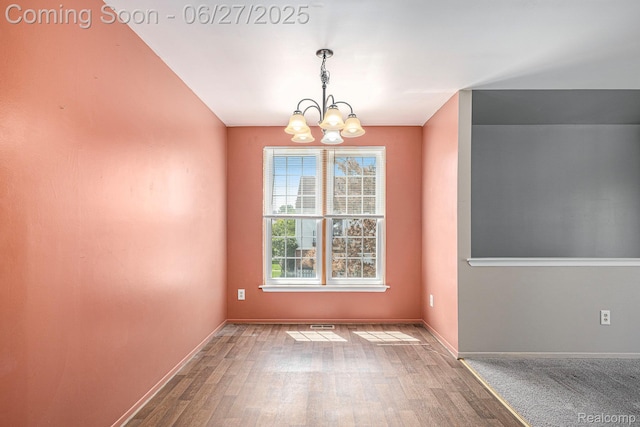 35692 Stillmeadow Ln, Shelby Twp, MI 48035 - unfurnished room featuring a chandelier and wood finished floors
