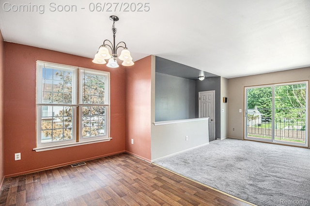 35692 Stillmeadow Ln, Shelby Twp, MI 48035 - unfurnished room featuring a chandelier and wood finished floors