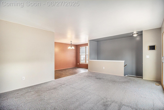35692 Stillmeadow Ln, Shelby Twp, MI 48035 - spare room featuring carpet flooring and a chandelier