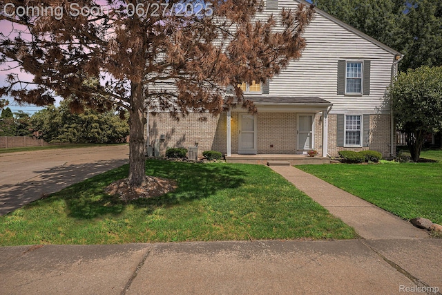 35692 Stillmeadow Ln, Shelby Twp, MI 48035 - view of front of home with brick siding and a front yard
