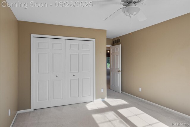 17601 Rolling Woods Cir, Northville, MI 48168 - unfurnished bedroom with light colored carpet, a closet, and a ceiling fan