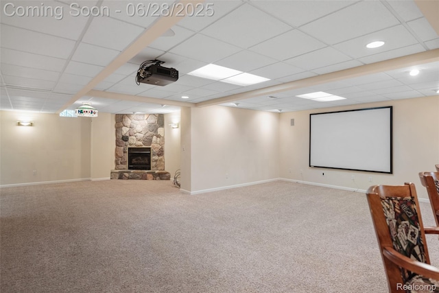 17601 Rolling Woods Cir, Northville, MI 48168 - carpeted cinema room with a paneled ceiling and a stone fireplace